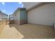 View of the backyard space featuring straw and wood fencing at 21044 E 63Rd Dr, Aurora, CO 80019