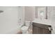 Bathroom showcasing a single sink vanity and a shower/tub combo with white finishes at 21044 E 63Rd Dr, Aurora, CO 80019