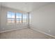Bright and spacious bedroom with multiple windows offering plenty of natural light and scenic outdoor views at 21044 E 63Rd Dr, Aurora, CO 80019