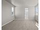 Spacious, bright bedroom with light gray walls and large windows at 21044 E 63Rd Dr, Aurora, CO 80019