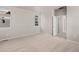 Comfortable bedroom with neutral carpet, natural light, and access to bathroom at 21044 E 63Rd Dr, Aurora, CO 80019