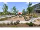Outdoor view of the community area, including picnic tables and landscaping at 21044 E 63Rd Dr, Aurora, CO 80019