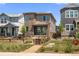 Charming two-story home with stone accents and a well-maintained front yard at 21044 E 63Rd Dr, Aurora, CO 80019