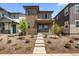 Charming two-story home with a stone facade and manicured front yard at 21044 E 63Rd Dr, Aurora, CO 80019