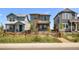 Charming two-story home with stone accents and a well-maintained front yard at 21044 E 63Rd Dr, Aurora, CO 80019
