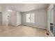 Bright living room featuring hardwood floors, a window, and a sliding door to the outside at 21044 E 63Rd Dr, Aurora, CO 80019