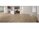 Spacious living room showcasing wood flooring and a modern open-concept design at 21044 E 63Rd Dr, Aurora, CO 80019