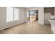 Bright living room featuring hardwood floors, a window, and a sliding door to the outside at 21044 E 63Rd Dr, Aurora, CO 80019