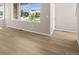 Bright living room with large windows and light wood flooring providing a modern, airy feel at 21044 E 63Rd Dr, Aurora, CO 80019