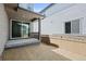 Backyard patio featuring a sliding door and a partially fenced in yard at 21044 E 63Rd Dr, Aurora, CO 80019