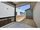 Covered patio with a view of the fenced backyard and neighboring houses at 21044 E 63Rd Dr, Aurora, CO 80019