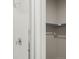 Close up of shower with white subway tile, chrome fixtures, and view into closet at 21044 E 63Rd Dr, Aurora, CO 80019