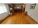 Bright living room featuring hardwood floors, large windows, and ample natural light at 7820 Mccella Ct, Westminster, CO 80030