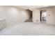 Partially finished basement area with neutral carpet, providing extra living space at 7373 E Iowa Ave # 1112, Denver, CO 80231