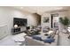 Finished basement with a lounge, stairway, entertainment center, and a plant at 7373 E Iowa Ave # 1112, Denver, CO 80231