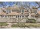 Charming townhouse exterior featuring well-kept lawns and a private fenced entrance at 7373 E Iowa Ave # 1112, Denver, CO 80231