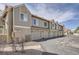 Townhouse garages offer convenient parking with a well-maintained driveway and landscaping at 7373 E Iowa Ave # 1112, Denver, CO 80231