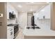 Modern kitchen with white cabinets, stainless steel appliances, and Quartz countertops at 7373 E Iowa Ave # 1112, Denver, CO 80231