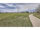 A picturesque park view with a walking path and lush green grass, ideal for recreation at 7373 E Iowa Ave # 1112, Denver, CO 80231