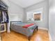 Cozy bedroom with hardwood floors and a window at 1640 N Downing St # 103, Denver, CO 80218