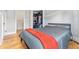 Bedroom featuring hardwood floors and closet space at 1640 N Downing St # 103, Denver, CO 80218