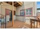 Outdoor deck with painted wood flooring and a small sitting area at 1640 N Downing St # 103, Denver, CO 80218