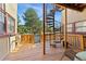 Outdoor deck with wood flooring and a unique spiral staircase to the upper level at 1640 N Downing St # 103, Denver, CO 80218