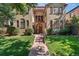 Charming home featuring a manicured lawn, quaint front entry, and warm curb appeal at 1640 N Downing St # 103, Denver, CO 80218