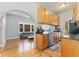 Bright kitchen with stainless steel appliances and a view into the adjacent living space at 1640 N Downing St # 103, Denver, CO 80218