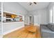 Open living area with hardwood floors, an open kitchen view, and a grey color scheme at 1640 N Downing St # 103, Denver, CO 80218