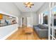 Sunlit living space showcasing hardwood floors, neutral tones, and connection to the kitchen at 1640 N Downing St # 103, Denver, CO 80218