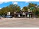 Street view of building with street signage and cars driving by at 1640 N Downing St # 103, Denver, CO 80218