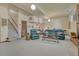 Finished basement offering seating, fireplace, and stairs at 30 Eagle Dr, Littleton, CO 80123