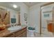 Bathroom with a vanity, toilet, and access to a walk-in closet at 30 Eagle Dr, Littleton, CO 80123