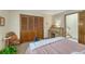 Comfortable bedroom with a desk, chair, and built-in closet at 30 Eagle Dr, Littleton, CO 80123
