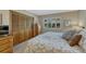Bedroom with natural light, closet and shuttered windows to the outside at 30 Eagle Dr, Littleton, CO 80123