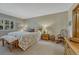 Comfortable bedroom featuring a queen bed, wood furnishings, and warm lighting for a relaxing ambiance at 30 Eagle Dr, Littleton, CO 80123