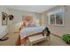Cozy bedroom with large window, comfortable bed, and decorative accents at 30 Eagle Dr, Littleton, CO 80123