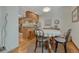 Cozy dining area with table and chairs next to the kitchen featuring a round carpet at 30 Eagle Dr, Littleton, CO 80123