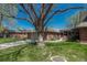 Charming single Gathering home with a two car garage and a lush green lawn in a mature neighborhood at 30 Eagle Dr, Littleton, CO 80123