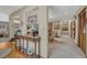 Elegant hallway with hardwood floors, stylish console table, and seamless flow to other living areas at 30 Eagle Dr, Littleton, CO 80123