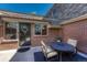 Cozy outdoor patio with table and chairs, perfect for relaxing or entertaining guests at 30 Eagle Dr, Littleton, CO 80123