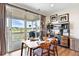 Cozy dining area with sliding glass doors to outdoor patio and stylish buffet at 3699 Makley Cir, Castle Rock, CO 80104