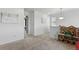 Bright hallway with neutral carpet and white walls, leading to bedrooms and featuring playful decor at 3699 Makley Cir, Castle Rock, CO 80104