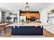 Bright modern kitchen with a large island, granite countertops, stainless steel appliances, and a dining area at 3699 Makley Cir, Castle Rock, CO 80104