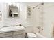 Bright bathroom with tiled sink, mirror, shower and tub combination at 1279 S Sable Blvd, Aurora, CO 80012