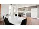 Open dining area with modern table and chairs connecting to bright kitchen at 1279 S Sable Blvd, Aurora, CO 80012