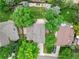 Aerial view showcases a private backyard, mature trees, and well-maintained landscaping at 4393 E Andover Ave, Castle Rock, CO 80104