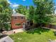 Backyard view showcasing lush greenery, a wooden deck, patio, and a well-maintained lawn, ideal for relaxing and entertaining at 4393 E Andover Ave, Castle Rock, CO 80104