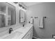 Modern bathroom with double vanity sinks and black fixtures at 4393 E Andover Ave, Castle Rock, CO 80104
